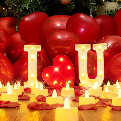 Décoration lumineuse "I Love You" avec lettres illuminées, comprenant 24 bougies LED, 1000 pétales de roses artificielles rouges, et 30 ballons rouges